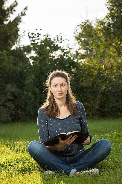 istock girl reading the Bible 511028495