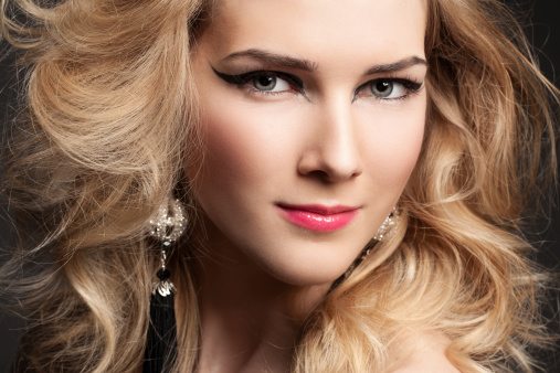 Fashion model with professional colorful makeup and hairstyle.
