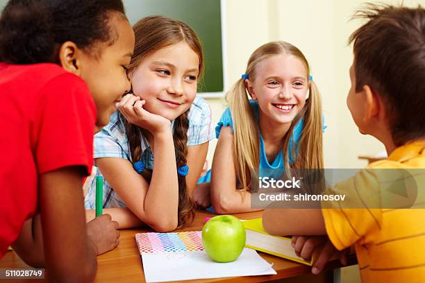 Classmates Chatting Stock Photo - Download Image Now - Adult, Cheerful, Child