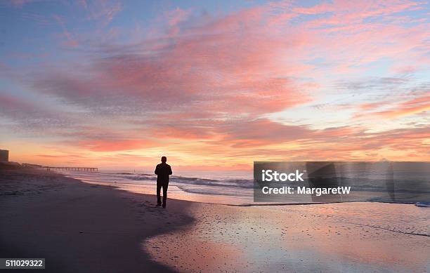 Man Relaxing On The Beach At Sunrise Stock Photo - Download Image Now - Beach, Walking, Contemplation
