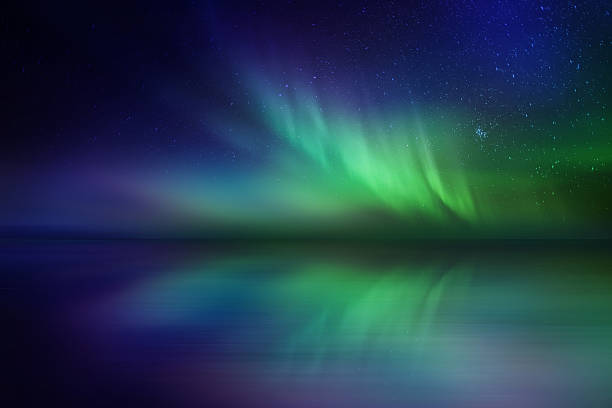 istock Amazing northern lights reflection over reflection on the sea 511029846