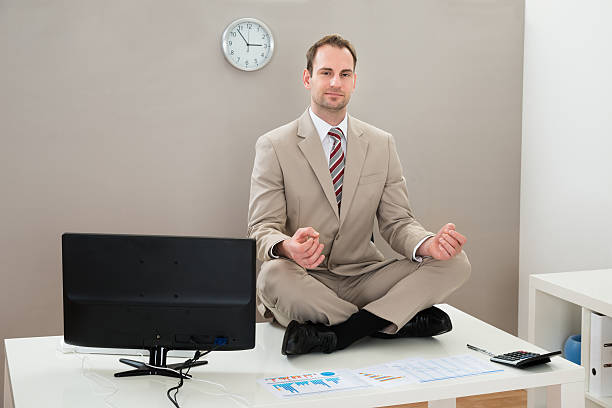 istock Businessman Doing Yoga In Office 511030226
