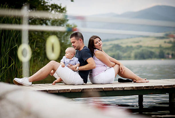 istock Family with baby on pier 511030781