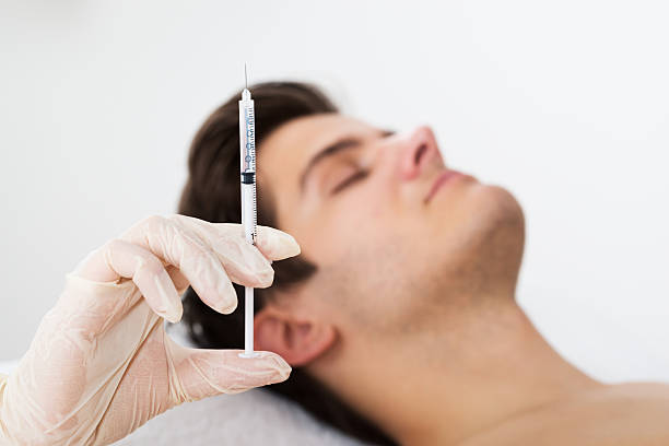 istock Man Getting Wrinkle Treatment From Doctor 511031256