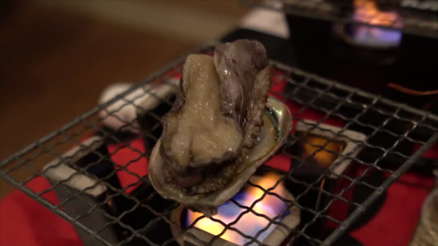 Grilling abalone on the barbecue