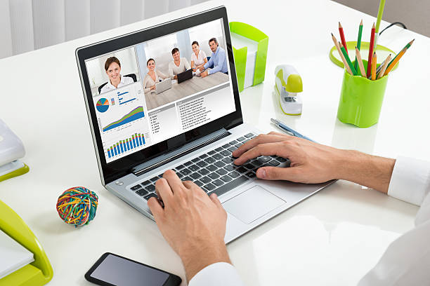 istock Businessperson Videoconferencing With Colleagues On Laptop 511050922