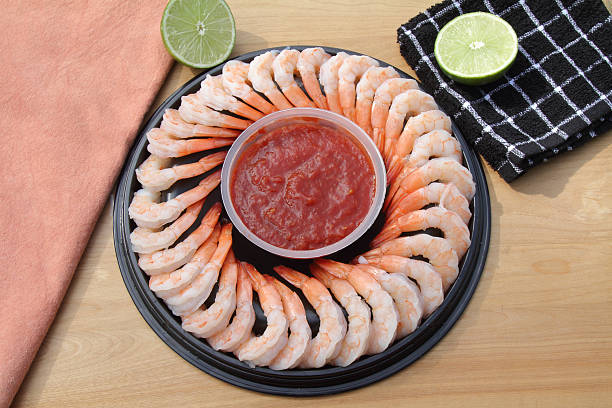 istock Platter of shrimp cocktail with lime and sauce 511051046