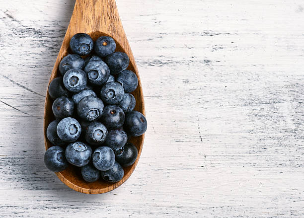 istock Spoon full of fresh black currant 511051126