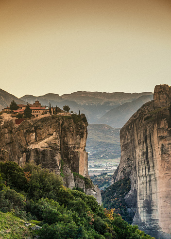 A look at the Kalabaka scenery, also called Kalambaka, in the Thessaly Plain, Greece. The monastery seen in background was built on those sandstone rock pillars, which can be seen in this image.