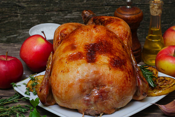 istock whole chicken noticed roasted with lemon and apples 511051718