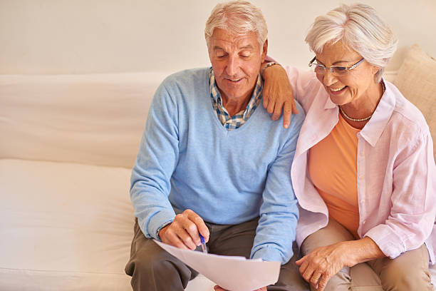 istock Senior couple checking their accounts at home 511052642