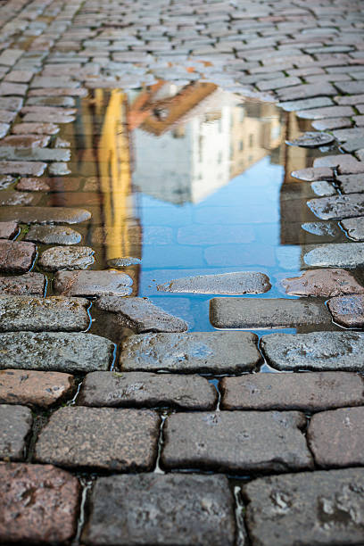 istock Rain puddle in Tallinn old town, Estonia 511053402