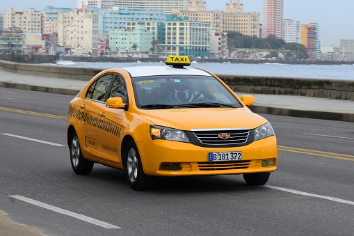 Havana, Cuba - January, 21th, 2016: Geely Emgrand7 in taxi version driving on the street. The Geely cars are the one of the most popular new vehicles in Cuba.