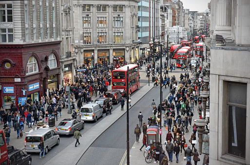 London, UK - February 19th 2016: A view from a high vantage point along London's main retail area Oxford Street, with public, shops and London buses