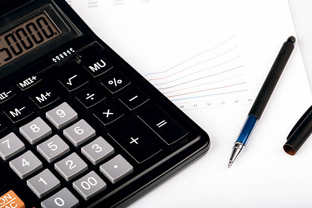istock Business Charts with calculator and pen 511053802