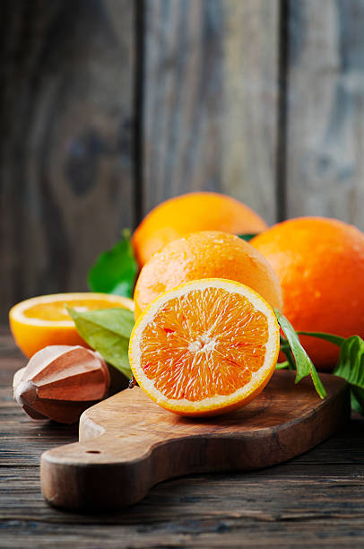 istock Fresh sweet oranges on the wooden table 511054456