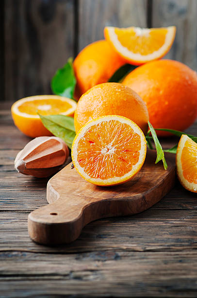 istock Fresh sweet oranges on the wooden table 511054538