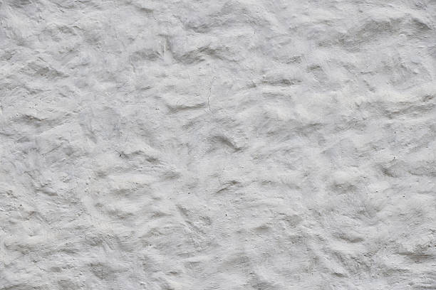 istock White wall of embossed decorative plaster 511056250
