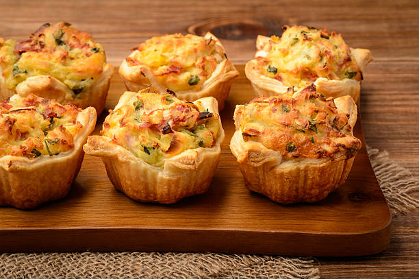 istock Tartlets baked with mashed potato, cheese, ham and parsley. 511057324