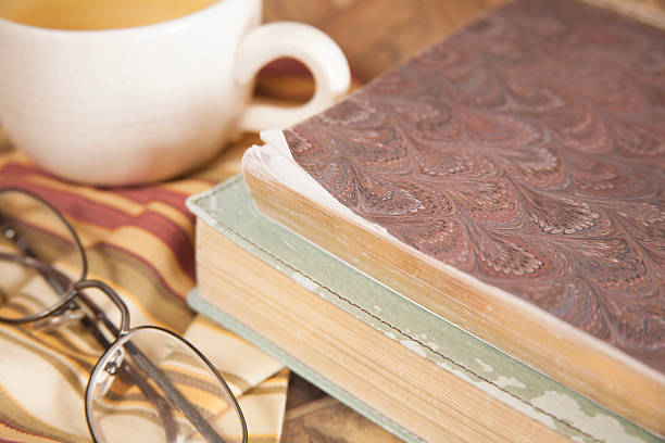 istock Tea cup, book, glasses.  Reading, relaxation. 511058670