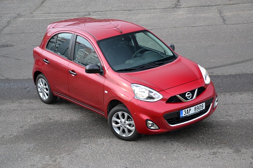 Prague, Czech Republic - November, 5th, 2013: Nissan Micra stopped on the street. The fourth generation of Micra was debut in 2010. This small city car is powered by petrol engine (pushing out 80 HP or 98 HP).