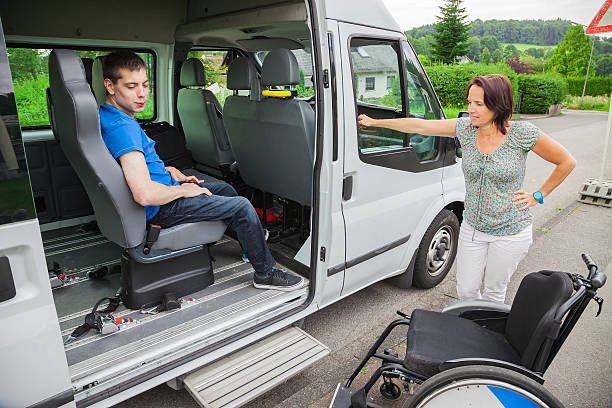 istock Handicapped boy is picked up by school bus 511059238