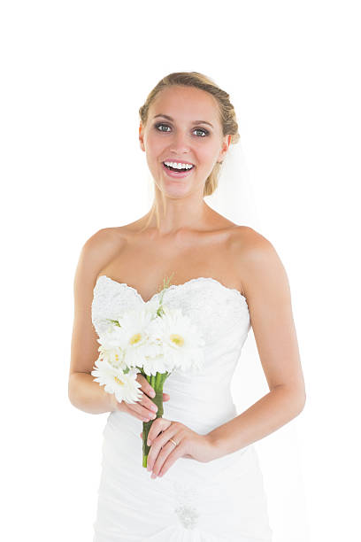 istock Laughing young bride posing and holding a bouquet 511059615