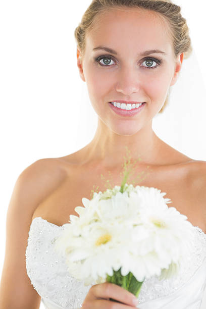 istock Gorgeous blonde bride posing holding a bouquet 511059635
