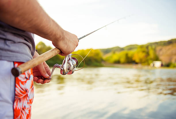 istock fishman with fishing rod 511060439