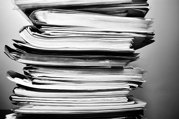 Stack of files on his desk Stack of files on his desk post structure photos stock pictures, royalty-free photos & images