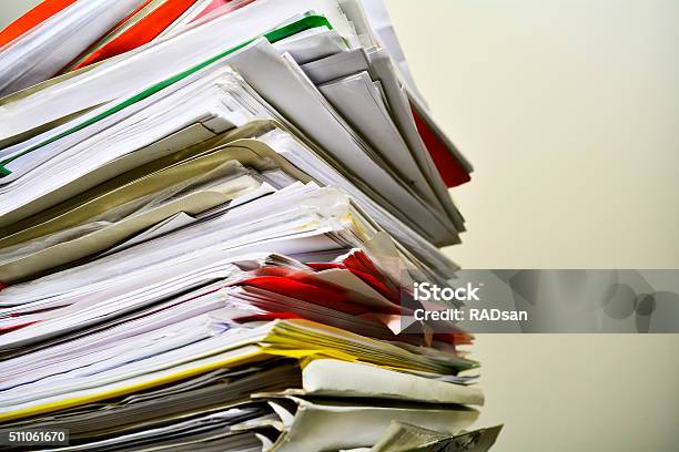 Stack Of Files On His Desk Stock Photo - Download Image Now - Stack, Document, Paper