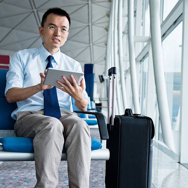 istock businessman at departure lounge 511062585