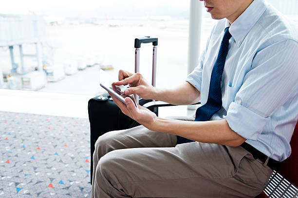 istock businessman at departure lounge 511062627