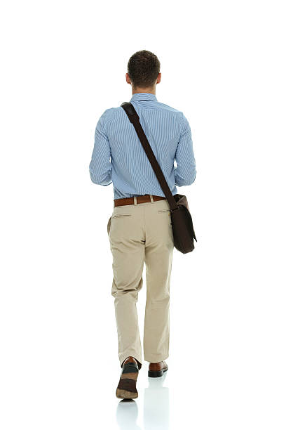 istock Rear view of businessman walking 511062752