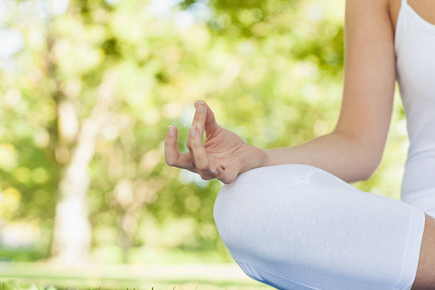 istock Mid section of calm young woman meditating 511062983