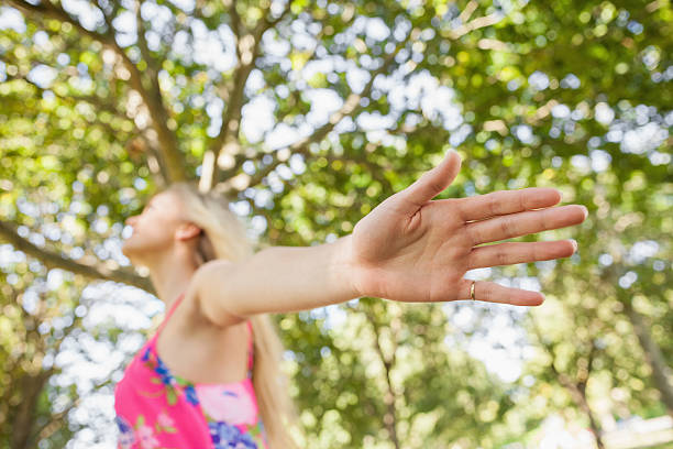 istock Blonde young woman standing on a lawn 511065697