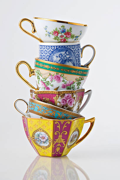 Pretty Antique Tea and coffee cup tower Pretty Antique Tea and coffee cup tower on white background tea cup photos stock pictures, royalty-free photos & images