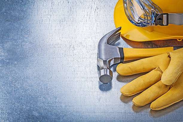 istock Protective eyewear hard hat safety gloves claw hammer constructi 511067456