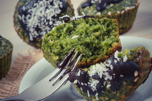 istock Fresh muffins with spinach, desiccated coconut and chocolate glaze 511068836