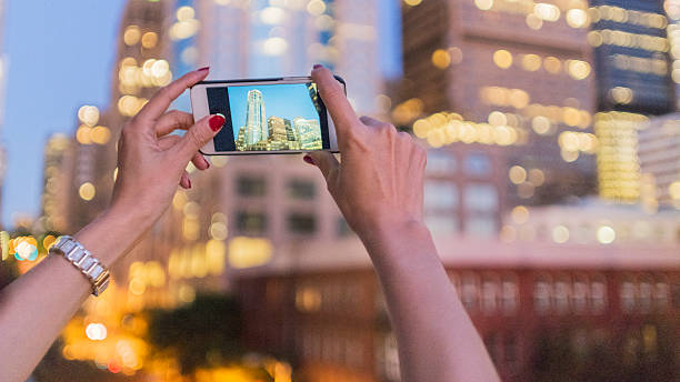 istock Japanese woman taking picture at night 511069992