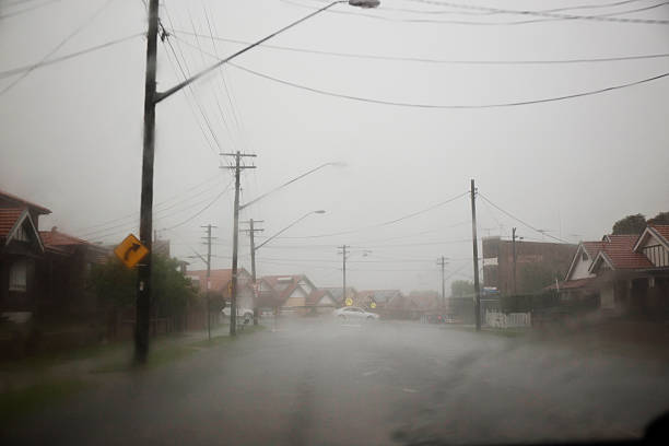 istock Heavy rain falling in a suburban street 511070370