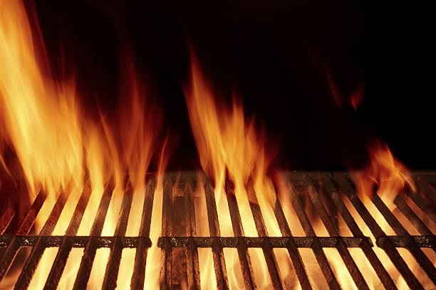 istock Empty Flaming Barbecue Grill Isolated On Black Background. Top V 511073352