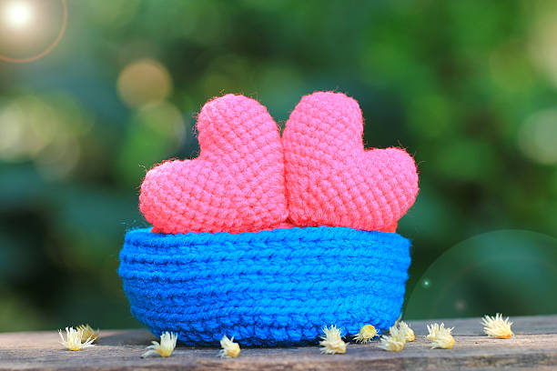 istock handmade crochet heart on green background. 511074090