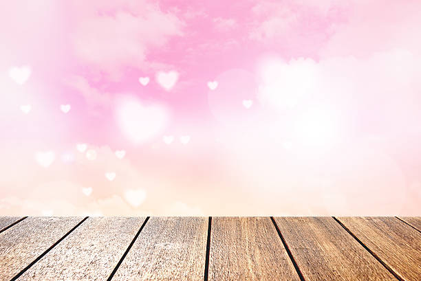 istock Wood planks floor and soft hearts background 511074568