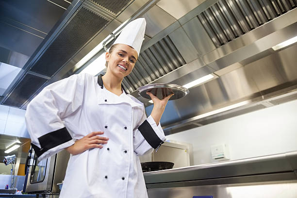 istock Young smiling chef holding tray 511093561
