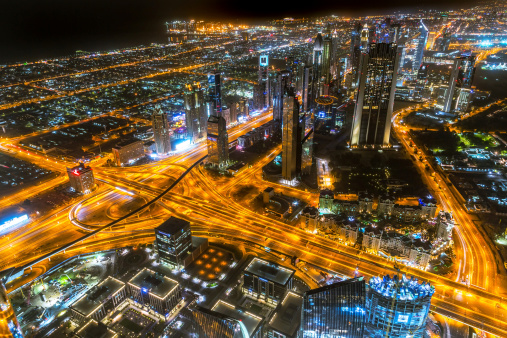 Dubai, UAE -  April 1, 2014:  View from the 124 floor of Burj Khalifa for the city centre of Dubai at night, UAE