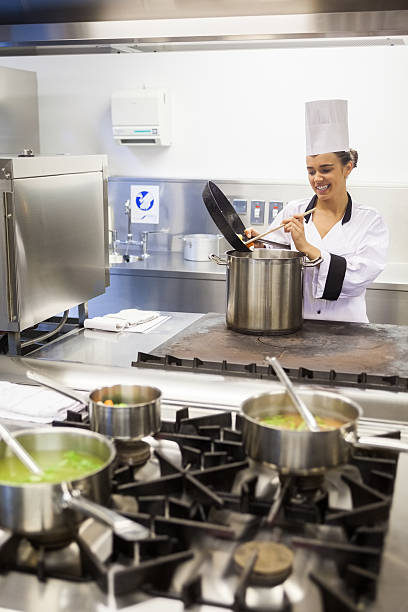 istock Young cheerful chef preparing meal 511093665