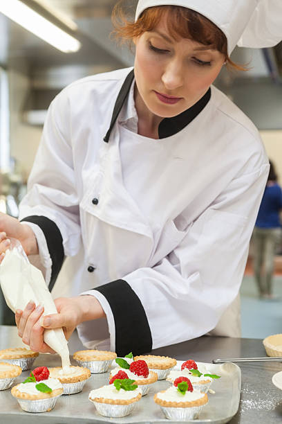istock Pretty concentrated head chef preparing dessert 511097301
