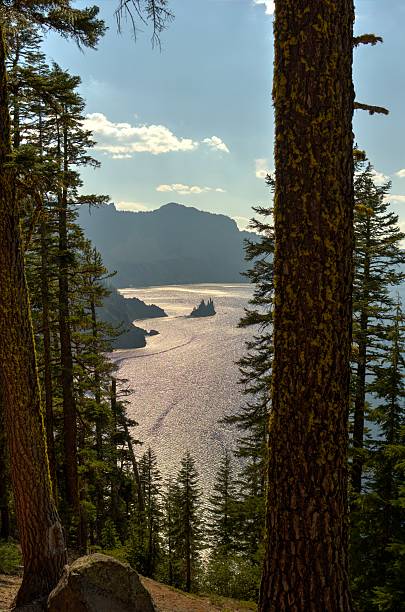 istock Phantom Ship in Crater Lake through trees 511097537