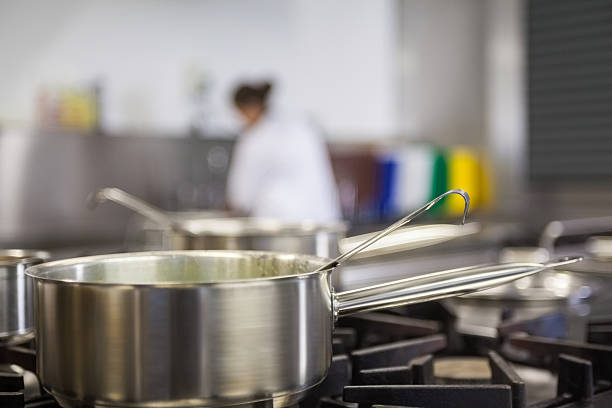 istock Chrome pot cooking on hotplates 511097557